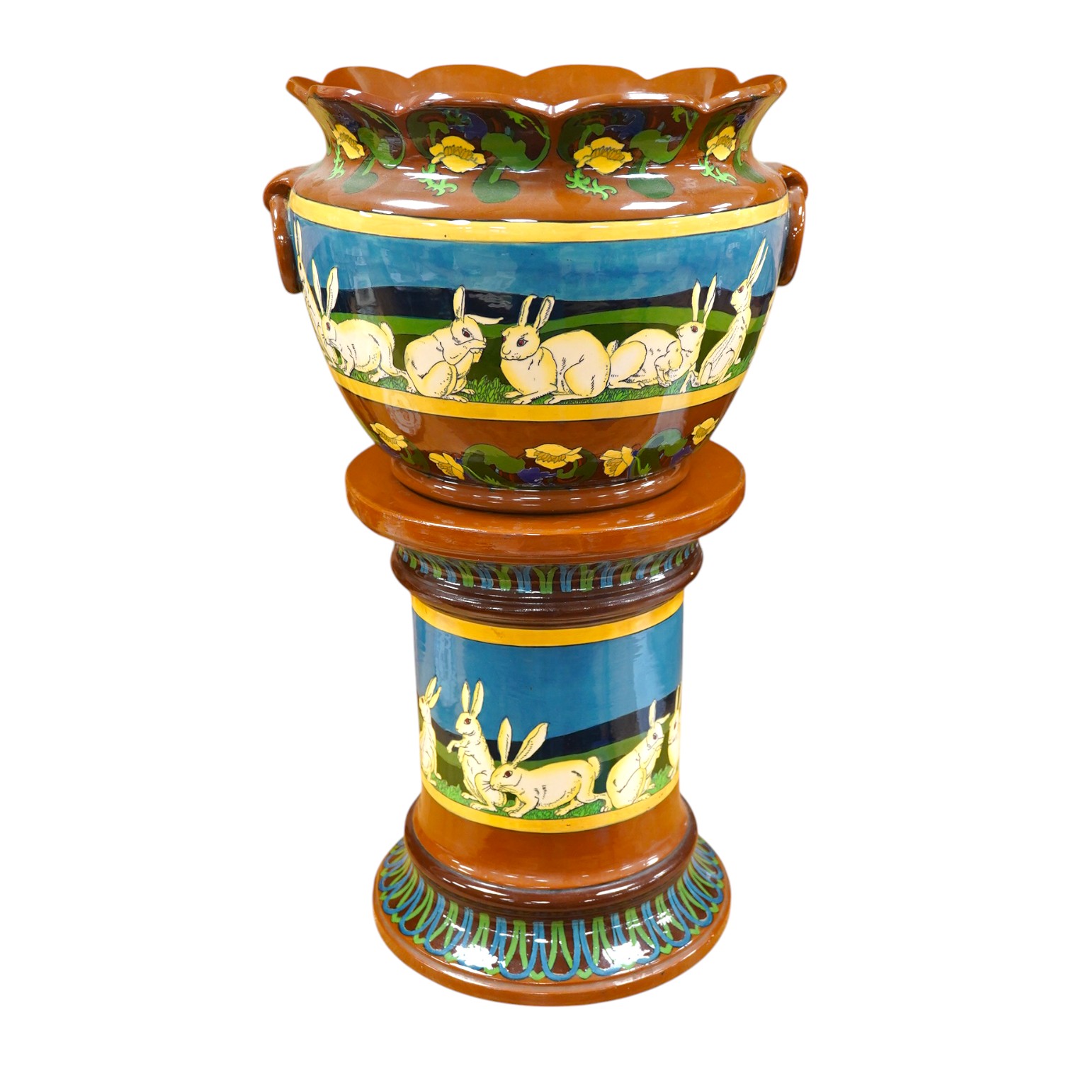 A large Foley Intarsio jardiniere on stand, designed by Frederick Rhead, decorated with rabbits, 60cm high. Condition - restored